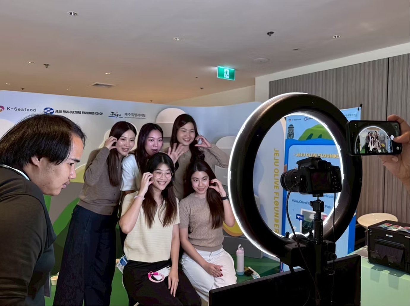 Group being photographed at the booth photo point