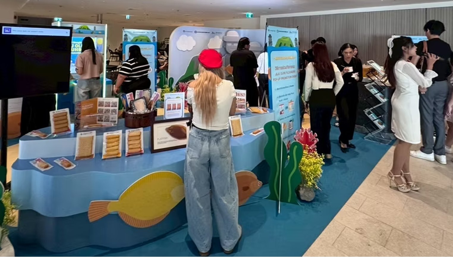 Visitors at the product display counter during the event