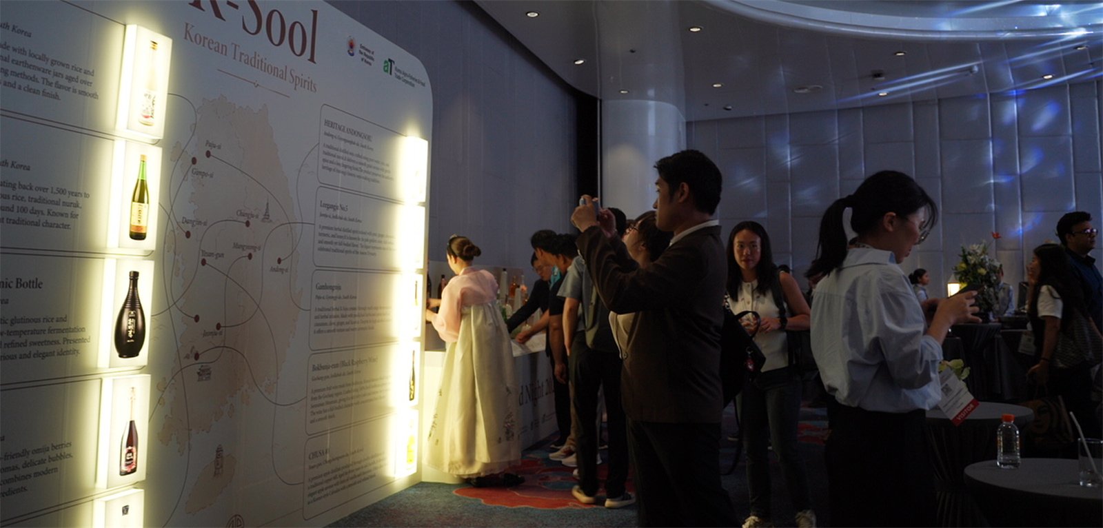 Guests photographing the K-Sool wall during the event